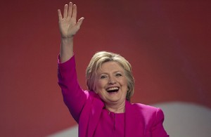 Democratic presidential candidate Hillary Clinton waves as she arrives to address the The National Education Association (NEA) Representative Assembly in Washington D.C., Tuesday, July 5, 2016. FBI Director James Comey said Tuesday, the FBI will not recommend criminal charges in its investigation into Hillary Clinton's use of a private email server while secretary of state. (AP Photo/Molly Riley)